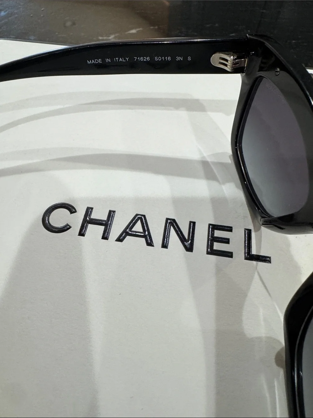 CHANEL Black Cat-Eye Sunglasses with Gold Chain Trim